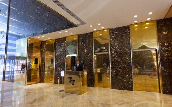 New York City, Ny, Usa - July 10, 2015:  Inside of the Trump Tower, lifts with employee. Trump Tower is a 68-story mixed-use skyscraper in Midtown Manhattan, NYC. It is 202 meters high.